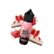 Οπτική απεικόνιση της συσκευασίας του Just Juice Strawberry Cheesecake 60ml με φόντο 2 κομμάτια πραγματικού cheesecake φράουλα.